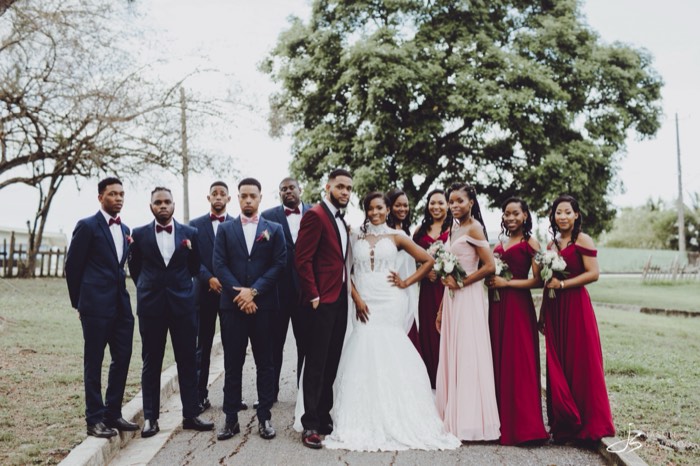 The whole wedding party outdoors after the ceremony