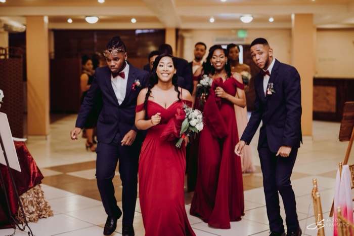 The wedding party arriving at the reception