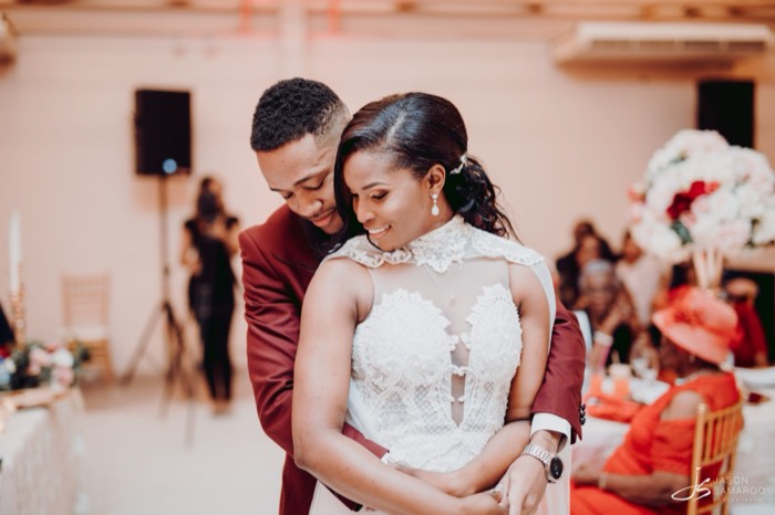 Javon and Kinisha holding each other during the reception