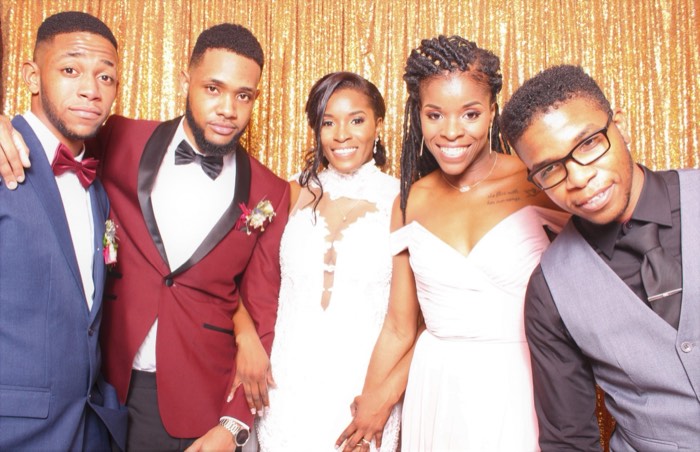 Guests posing together at the photo booth